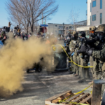 Conflict in Minnesota, USA, and the entry of armored vehicles into the city.